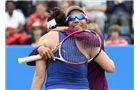 BIRMINGHAM, ENGLAND - JUNE 15:  Raquel Kops-Jones and Abigail Spears (L) of the United States celebrate victory in the Doubles Final during Day Seven of the Aegon Classic at Edgbaston Priory Club on June 15, 2014 in Birmingham, England.  (Photo by Tom Dulat/Getty Images)